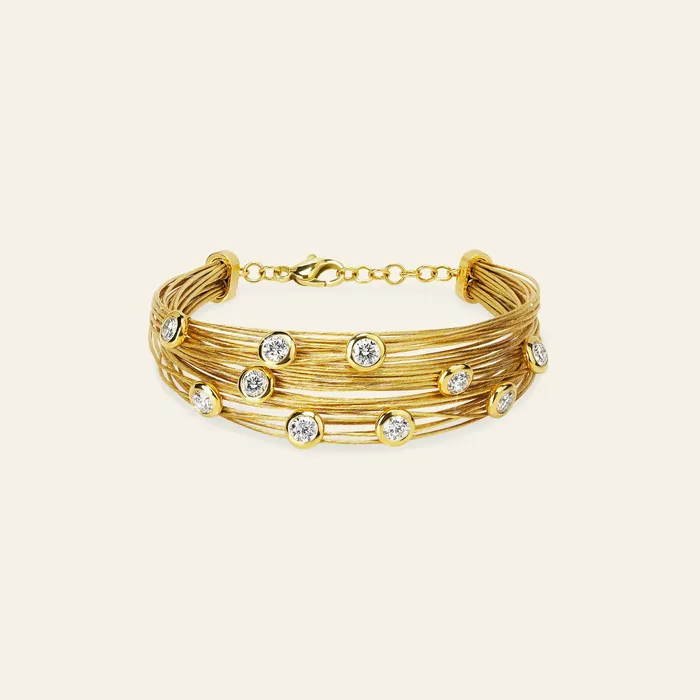 Bracelets Hand crafted in 18k yellow gold and set with 22 highquality round brilliant cut diamonds Spread The Love Bracelet