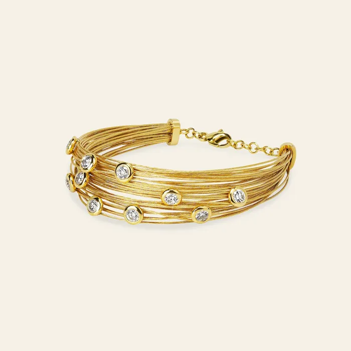 Bracelets Hand crafted in 18k yellow gold and set with 22 highquality round brilliant cut diamonds Spread The Love Bracelet