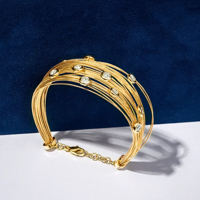 Bracelets Hand crafted in 18k yellow gold and set with 22 highquality round brilliant cut diamonds Spread The Love Bracelet